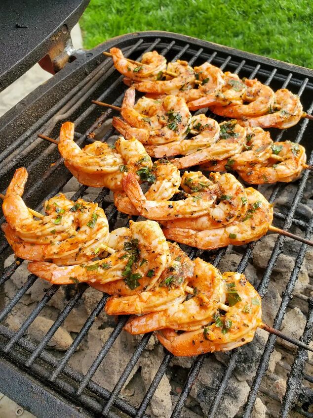 greek grilled shrimp with basil orange orzo, Shrimp skewers on a grill
