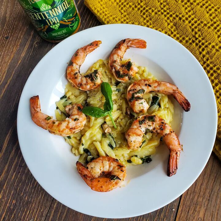 greek grilled shrimp with basil orange orzo, Plate of grilled shrimp over cheesy parmesan Orzo with basil and pine nuts