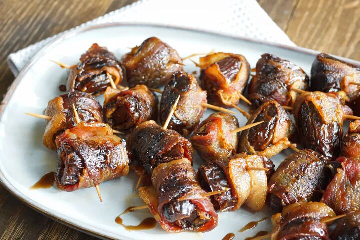 grilled bacon wrapped dates devils on horseback, Devils on horseback appetizer Grilled bacon wrapped dates stuffed with chorizo drizzled with balsamic vinegar