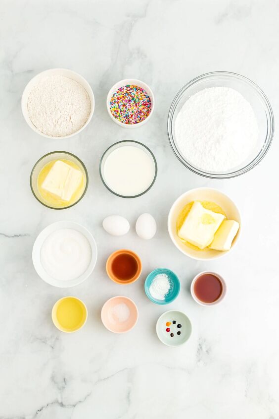 how to make a funfetti rainbow cake perfect for every celebration, overhead photo of the ingredients needed to make a funfetti rainbow cake