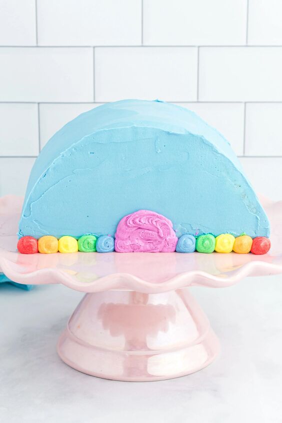 how to make a funfetti rainbow cake perfect for every celebration, beginning stage of frosting a rainbow cake
