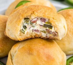 jalapeno popper rolls using crescent rolls, stacked jalapeno rolls on a plate