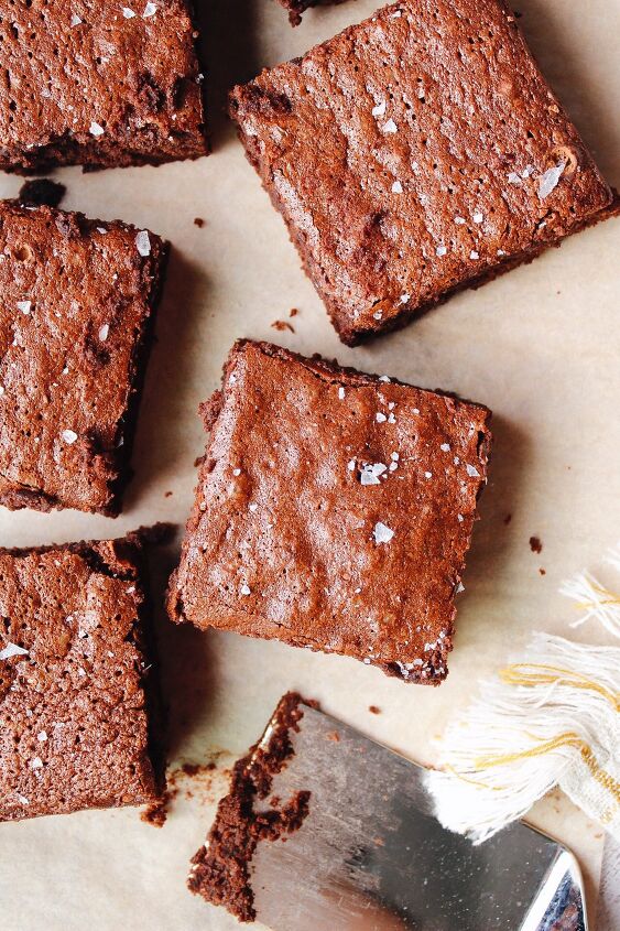 honey brownies, sourdough discard brownies arranged on parchment paper and topped with sea salt
