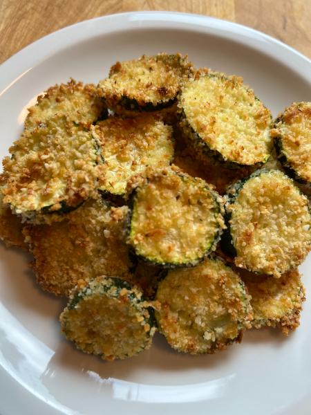 the best air fryer zucchini chips, Air Fried Zucchini Chips on a white plate
