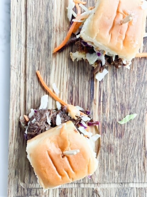 best recipe for braised korean beef short ribs on a slider, Braised Korean Beef Short Ribs On A Slider on a wooden board