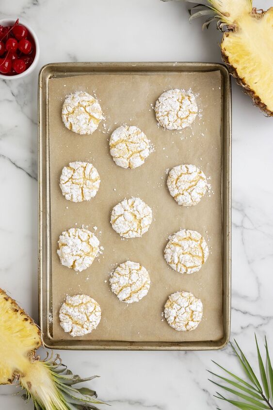 need a vacation try these pineapple cake mix cookies now, freshly baked crinkle cool whip cookies on a baking sheet