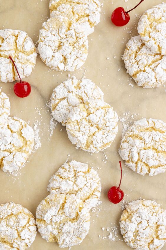 need a vacation try these pineapple cake mix cookies now, overhead view of pineapple crinkle cookies on parchment paper
