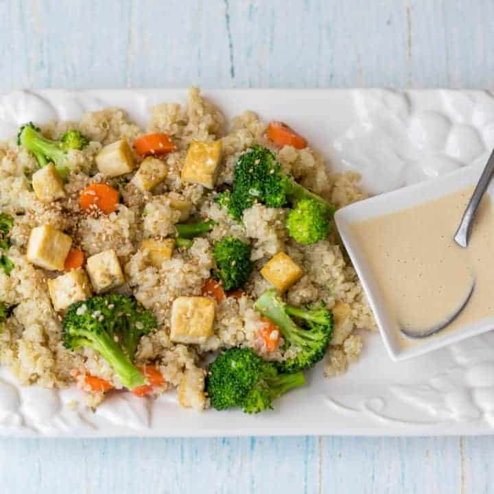 salmon coconut rice bowl, quinoa grain bowl with broccoli carrots tofu and sesame ginger dressing