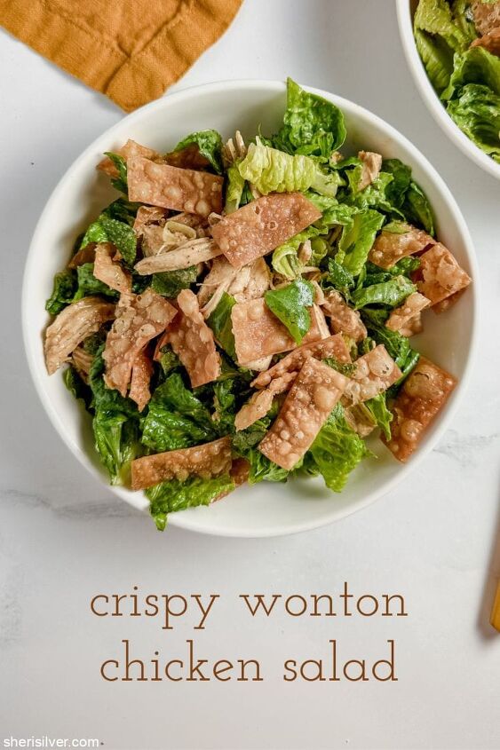 make this easy crispy wonton chicken salad recipe, crispy wonton chicken salad in a white ceramic bowl