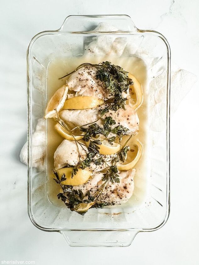 make this easy crispy wonton chicken salad recipe, oven baked chicken breasts with lemon and parsley in a glass baking dish
