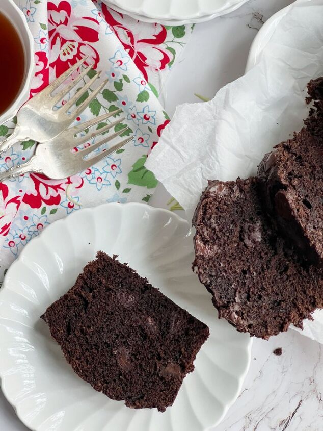 the best double chocolate zucchini bread, chocolate zucchini bread sliced on a white plate
