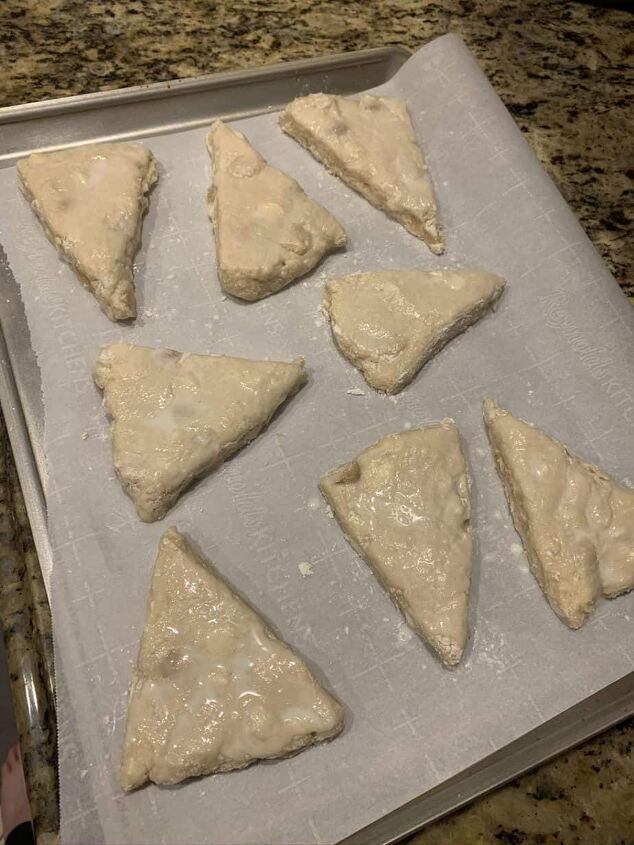 white chocolate macadamia nut scones, Dough cut and moved onto a parchment lined baking sheet and brushed with milk