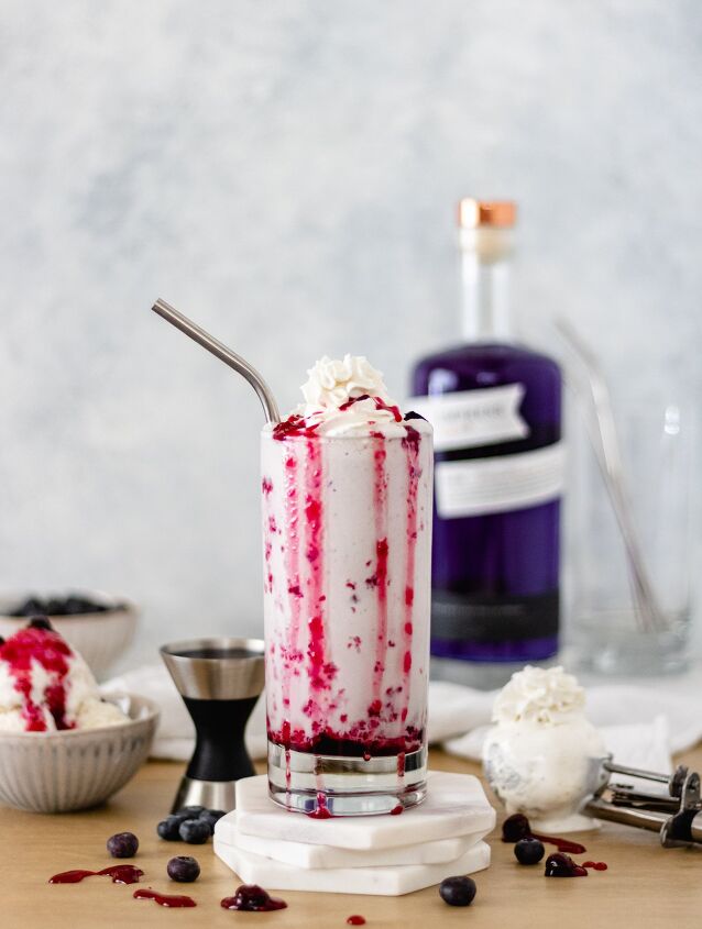 mixed berry ice cream shake, Mixed Berry Ice Cream Shake in a glass topped with coconut whipped cream