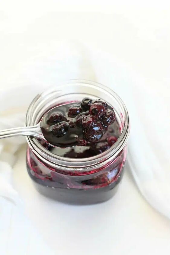 blueberry compote recipe, Fresh Blueberry compote in glass jar with a silver spoon