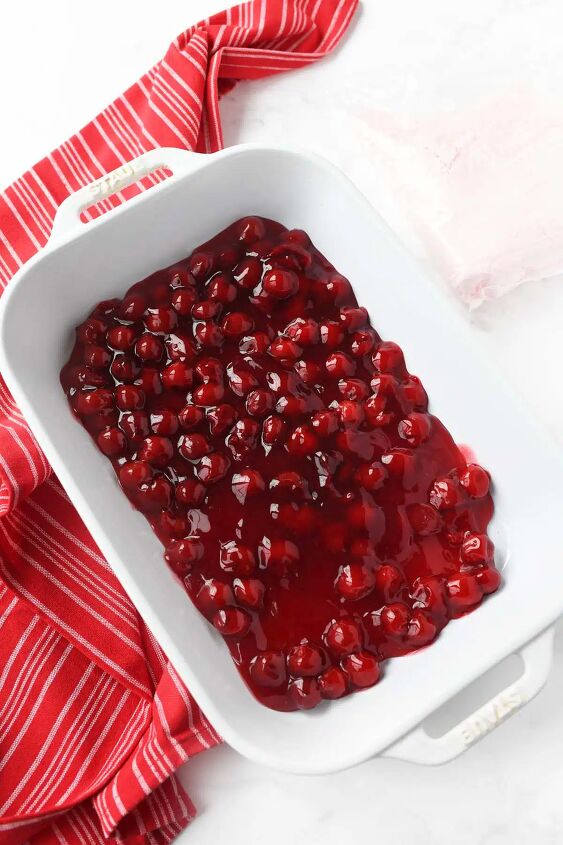 strawberry cherry dump cake, Canned cherries in a white pan