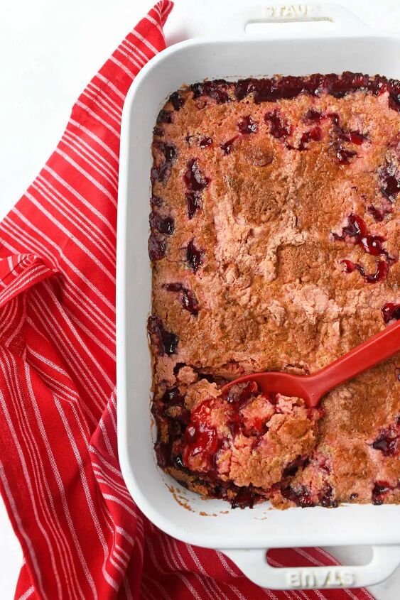 strawberry cherry dump cake, A red spoon in baked dump cake