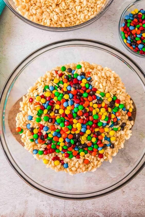 m m rice krispie treats, Cereal marshmallows and M M s being mixed together to make M M Rice Krispie Treats