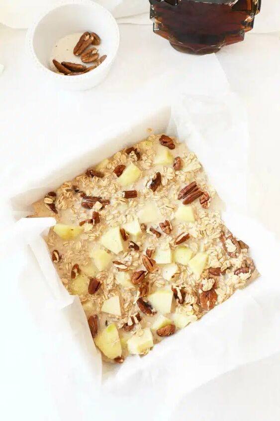 baked apple oatmeal, Baked oatmeal with apples prebaked in a white lined dish