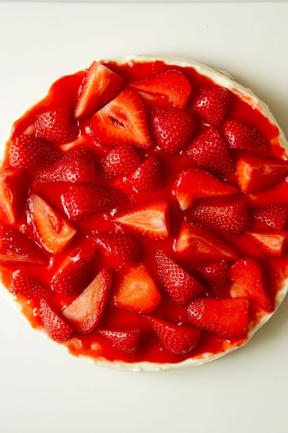 philadelphia condensed milk no bake strawberry cheesecake, No Bake Strawberry Cheesecake in a white dish topped with fresh strawberries ready for serving