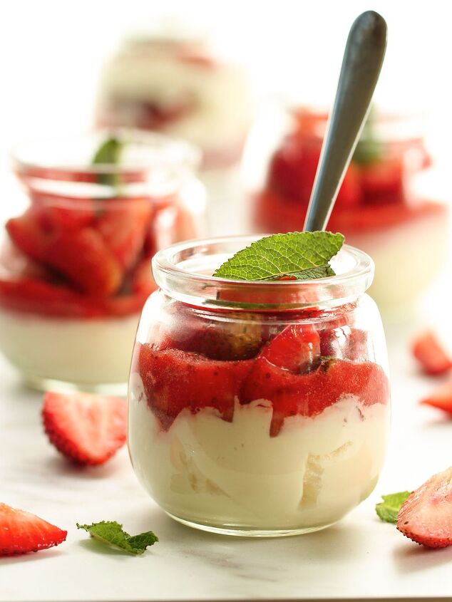 philadelphia condensed milk no bake strawberry cheesecake, A dessert jar of strawberries and cream with a mint leaf topping