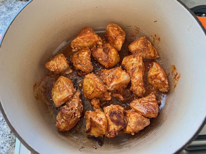 galinhada dutch oven chicken and rice, Marinated chicken cooking in a pot for Galinhada Dutch Oven Chicken and Rice