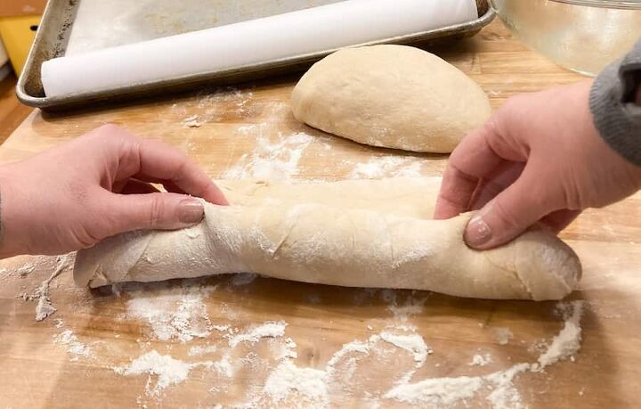 sourdough french bread with yeast whole wheat, rolling up the dough to make a sourdough french loaf
