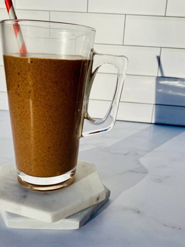 blueberry protein shake, A snickers smoothie in a clear glass with a red and white straw