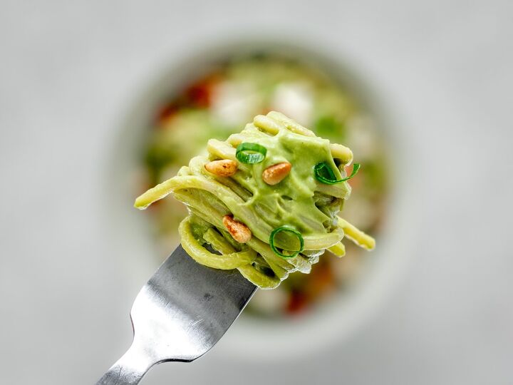 vegan avocado pasta, Close up of creamy vegan avodado pasta on a fork