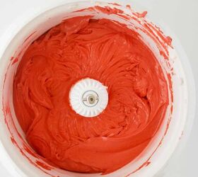 red velvet bundt cake with cream cheese, A bowl of red icing on a white surface