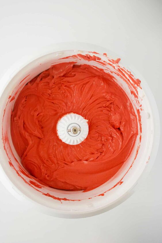 red velvet bundt cake with cream cheese, A bowl of red icing on a white surface