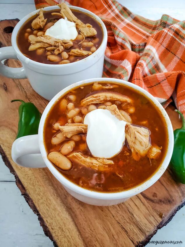 slow cooker chicken chili with white beans, two bowls of the finished chili ready to serve