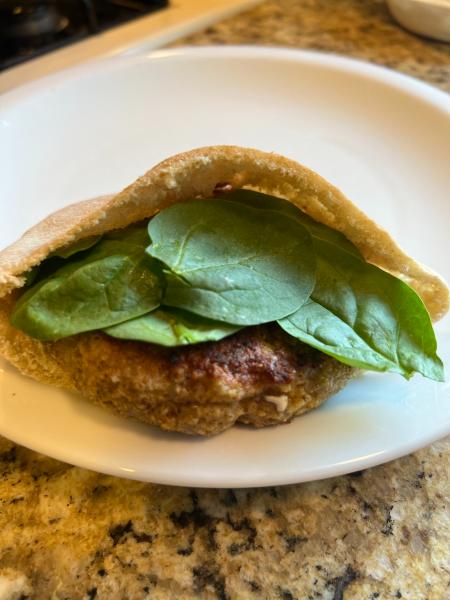 easy and delicious meatballs, Plated Shrimp Burger in a pita with baby spinach and yogurt dip