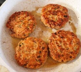fresh salmon burgers with easy lemon dill sauce, Salmon burger patties in a skillet