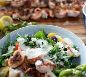 grilled shrimp caesar salad with blistered shishito peppers
