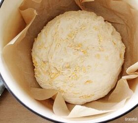 no knead cheddar bread in the dutch oven, Dough rising in a dutch oven lined with parchment paper