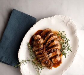 Maple Mustard Pork Tenderloin on a vintage serving platter with rosemary sprigs