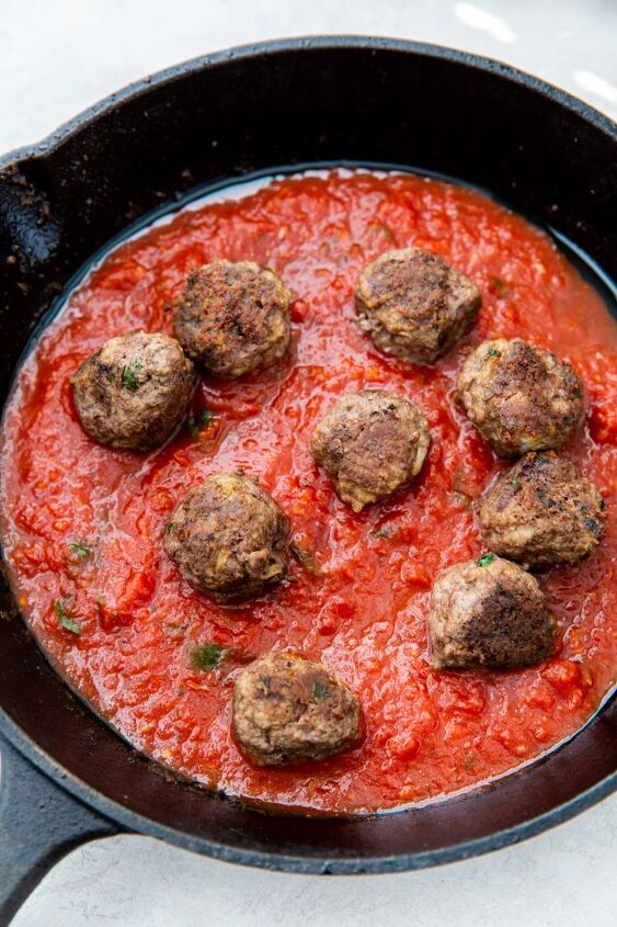 easy keto cast iron meatballs, cooked keto meatballs in a keto spaghetti sauce