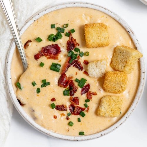 quick instant pot beef stew, A bowl of cheese soup with bacon and croutons