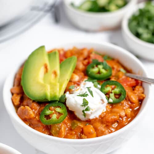 quick instant pot beef stew, A bowl of turkey pumpkin chili with sour cream and avocado