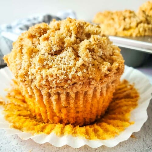 homemade spanakopita recipe, Pumpkin muffins with a crumb topping on a white plate