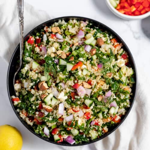 homemade spanakopita recipe, A bowl of quinoa salad on a white table