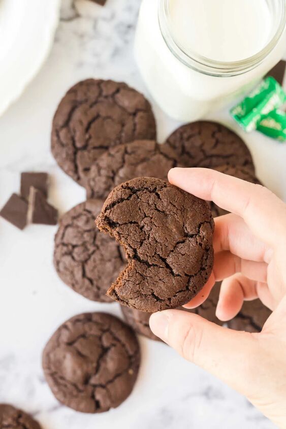 chocolate mint cookies, Hand holding chocolate mint cookie with a bite taken out of it