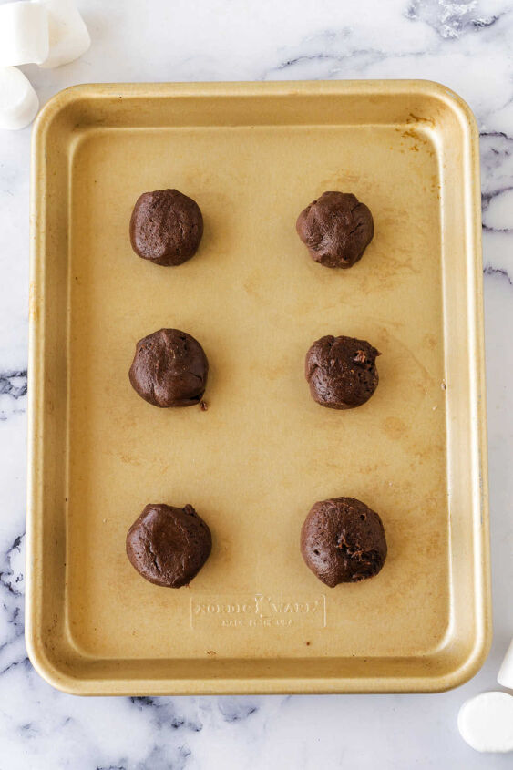 hot chocolate cookies, Scoops of chilled hot chocolate cookie dough on baking sheet ready to go in the oven