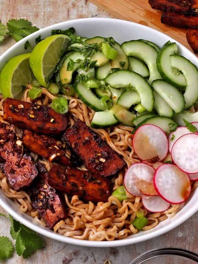 crispy salt and pepper tofu air fryer or baked, A bowl with noodles baked tofu radishes cucumber scallions cilantro and limes