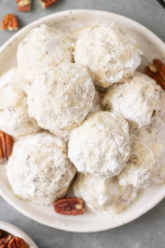 snowball cookie recipe with pecans, overhead of pecan snowball cookies on a white plate
