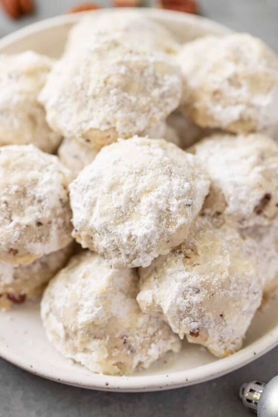 snowball cookie recipe with pecans, Close up of a plate of pecan snowball cookies or mexican wedding cookies