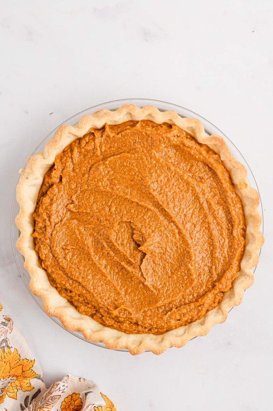 southern sweet potato pie recipe, An unbaked sweet potato pie on a white counter