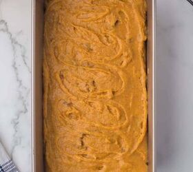 moist pumpkin bread, Uncooked Pumpkin loaf in a baking loaf pan on a marble counter