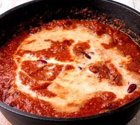 creamy rajma masala vegan kidney bean curry, Plant milk kidney beans and tomato sauce in a black pan