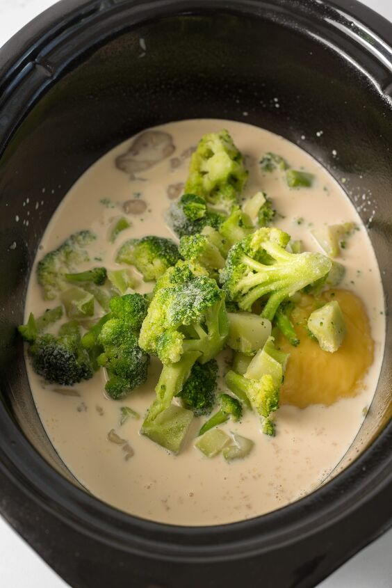 slow cooker broccoli cheese soup with velveeta, add broccoli into the soup